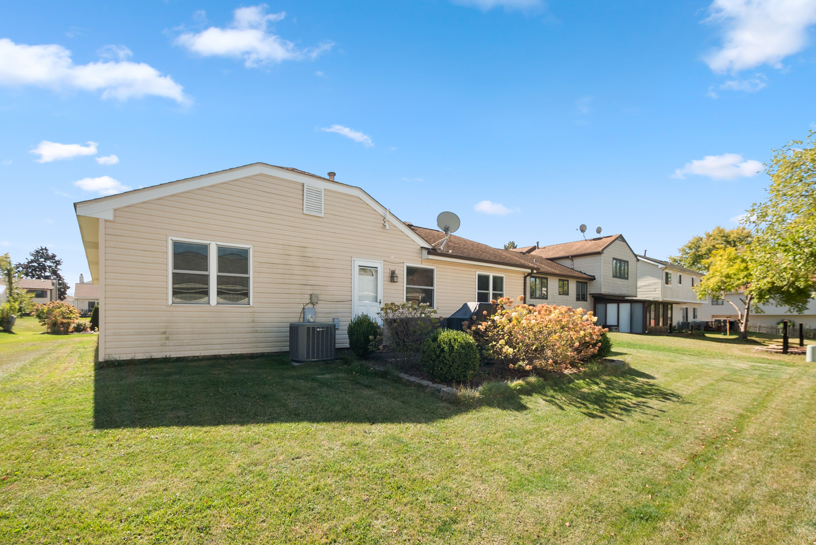 8 Warwick Court Streamwood, IL 60107 - Photo 13 of 14 a front view of a house with a yard and garage