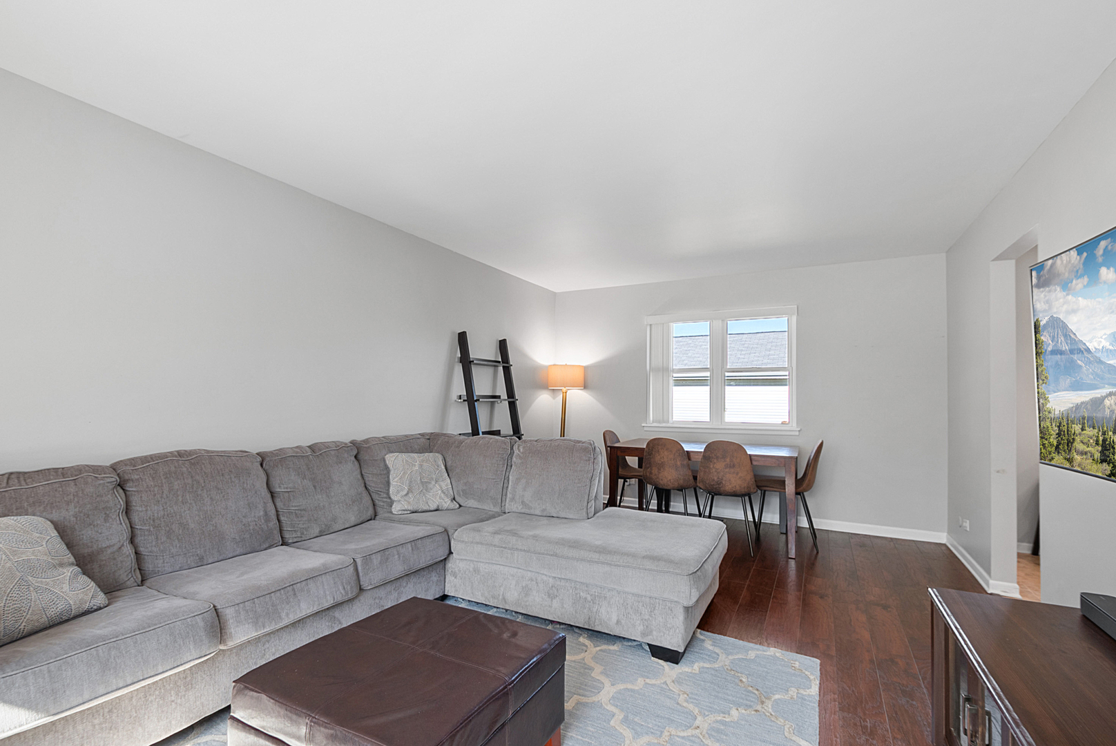 8 Warwick Court Streamwood, IL 60107 - Photo 3 of 14 a living room with furniture dining table and a window