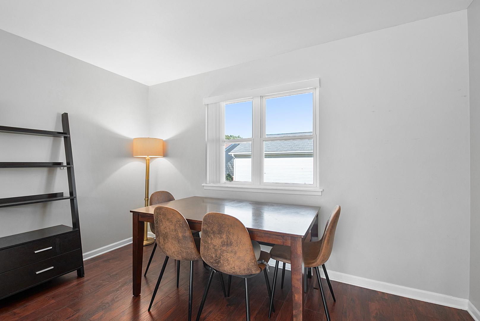 8 Warwick Court Streamwood, IL 60107 - Photo 4 of 14 a view of a dining room with furniture and wooden floor