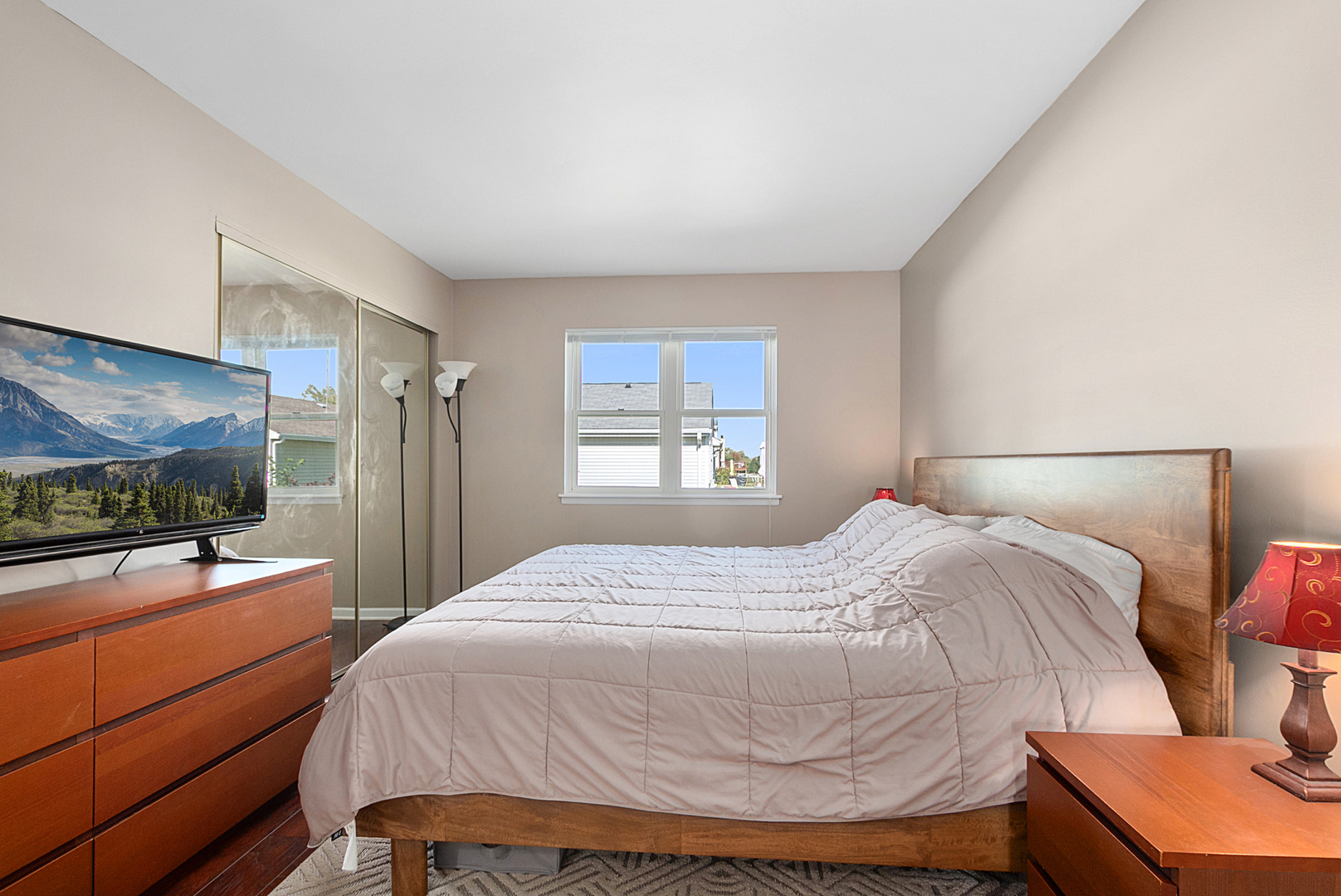 8 Warwick Court Streamwood, IL 60107 - Photo 7 of 14 a bedroom with a bed and a flat screen tv