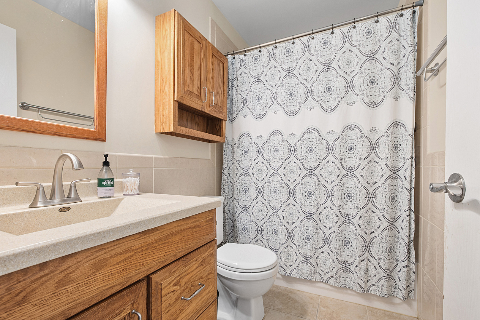 8 Warwick Court Streamwood, IL 60107 - Photo 10 of 14 a bathroom with a sink toilet and shower