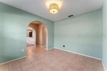 a view of a livingroom with a ceiling fan and window