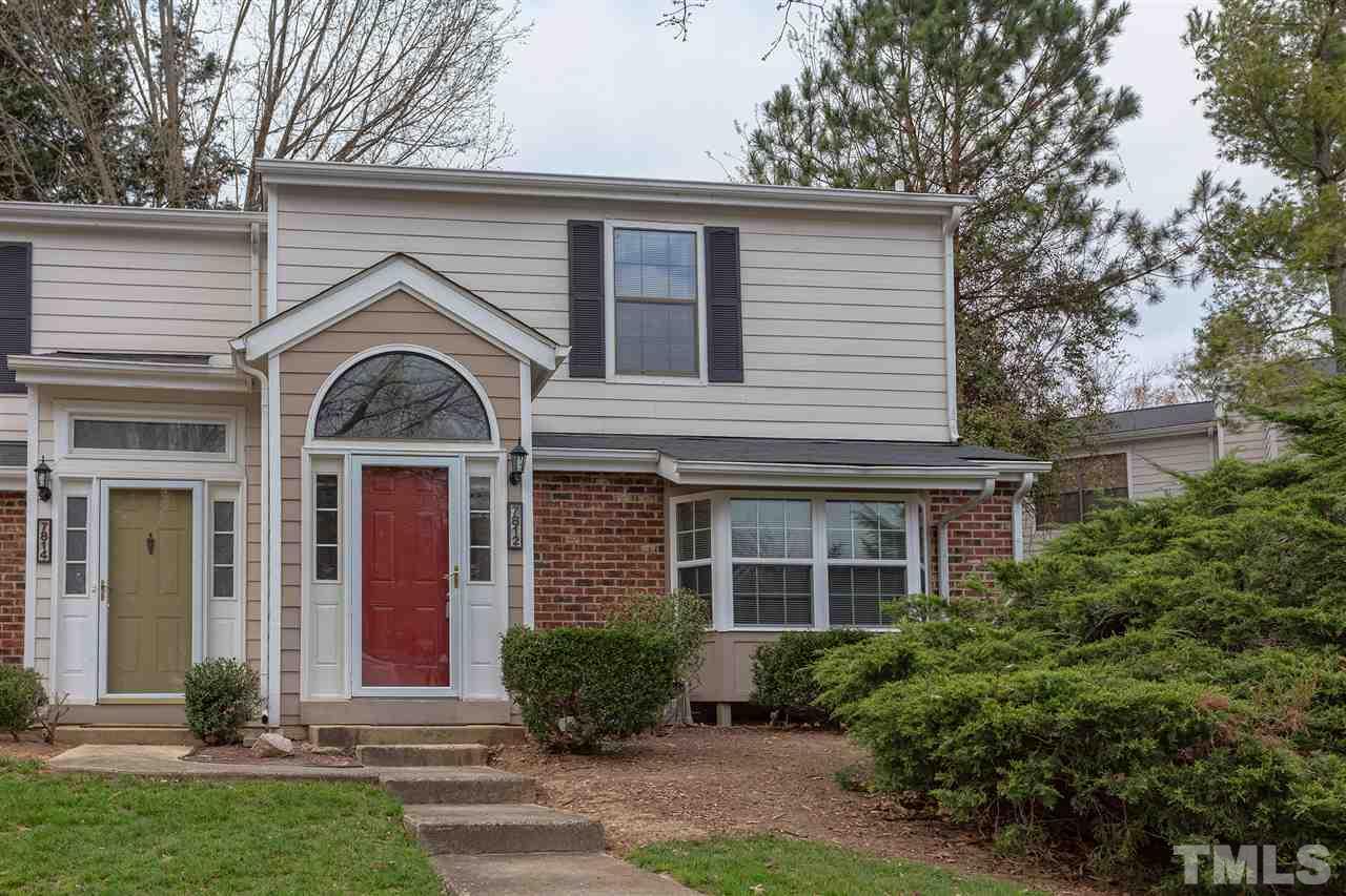 7812 Falcon Rest Circle Raleigh, NC 27615 - Photo 1 of 26 a front view of a house with garden