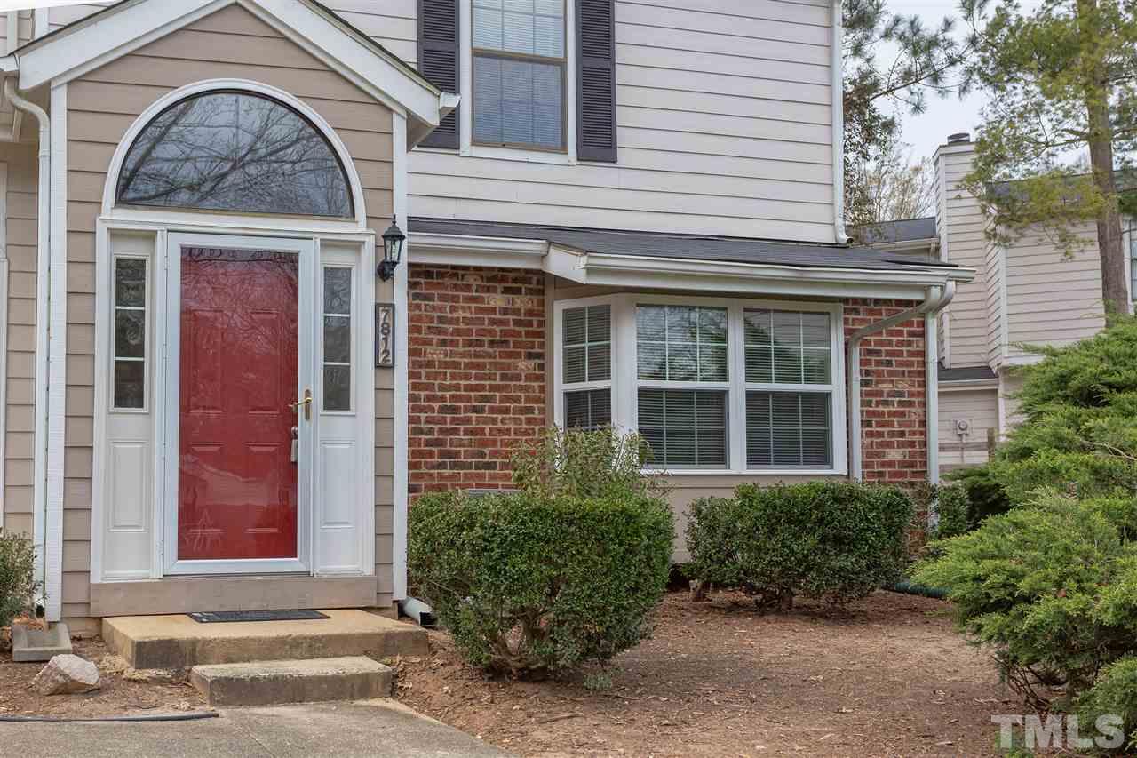 7812 Falcon Rest Circle Raleigh, NC 27615 - Photo 2 of 26 a front view of a house with garden
