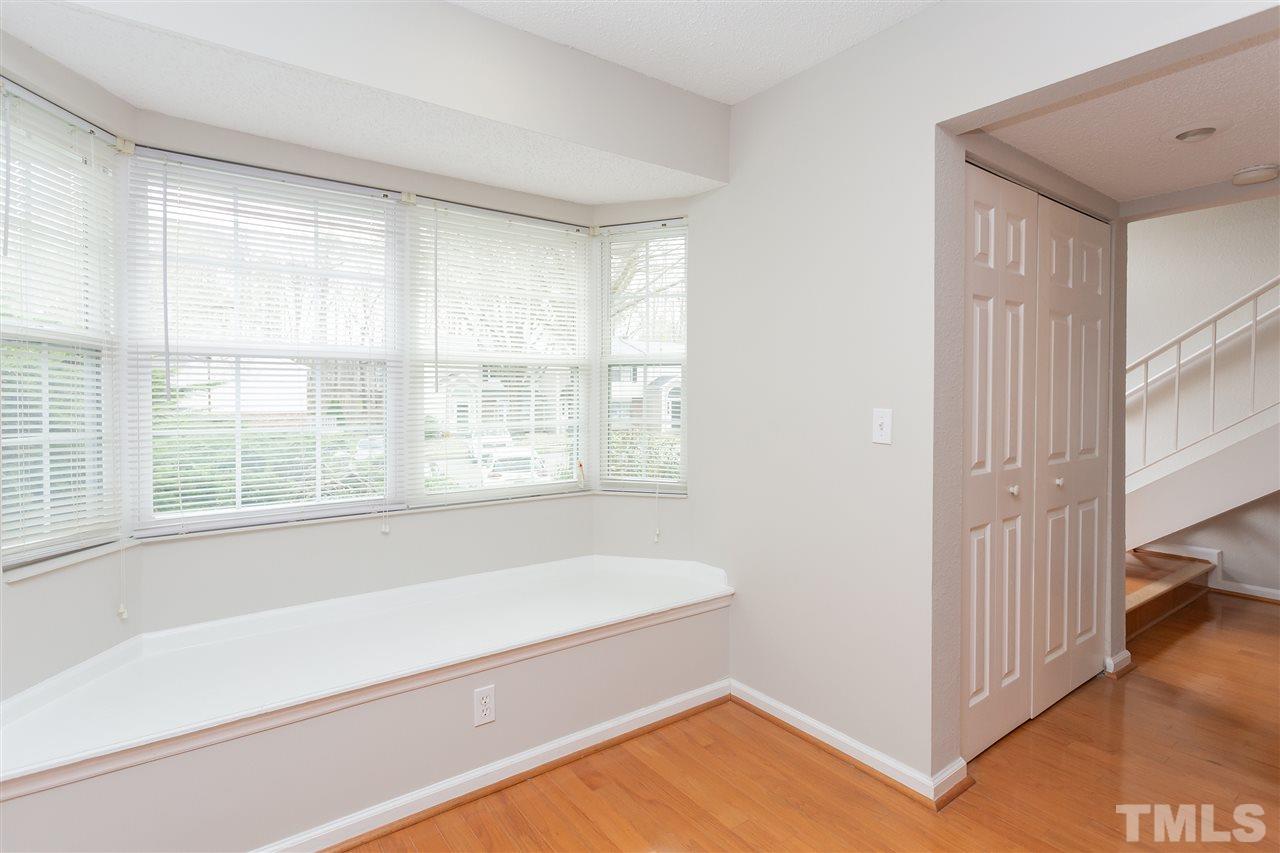 7812 Falcon Rest Circle Raleigh, NC 27615 - Photo 14 of 26 a bathroom with a bathtub and a window