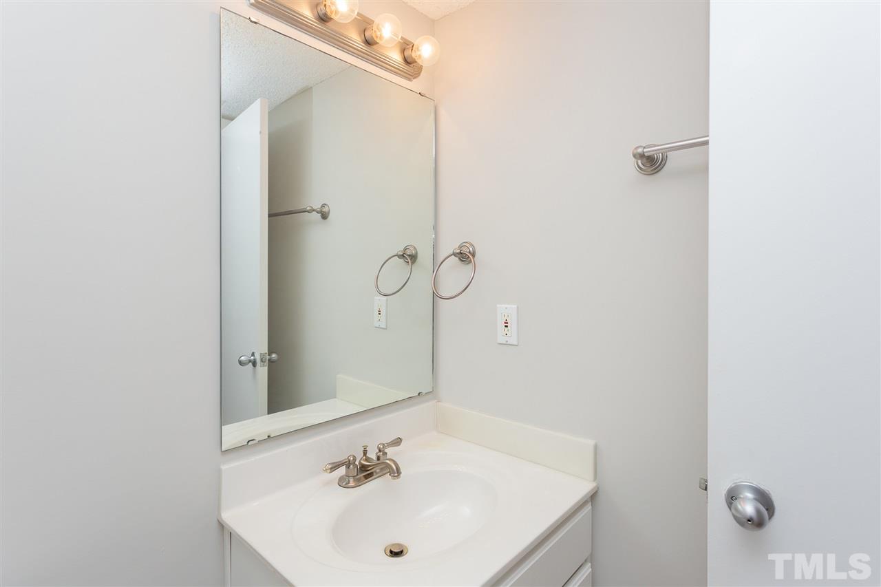 7812 Falcon Rest Circle Raleigh, NC 27615 - Photo 16 of 26 a bathroom with a sink and shower