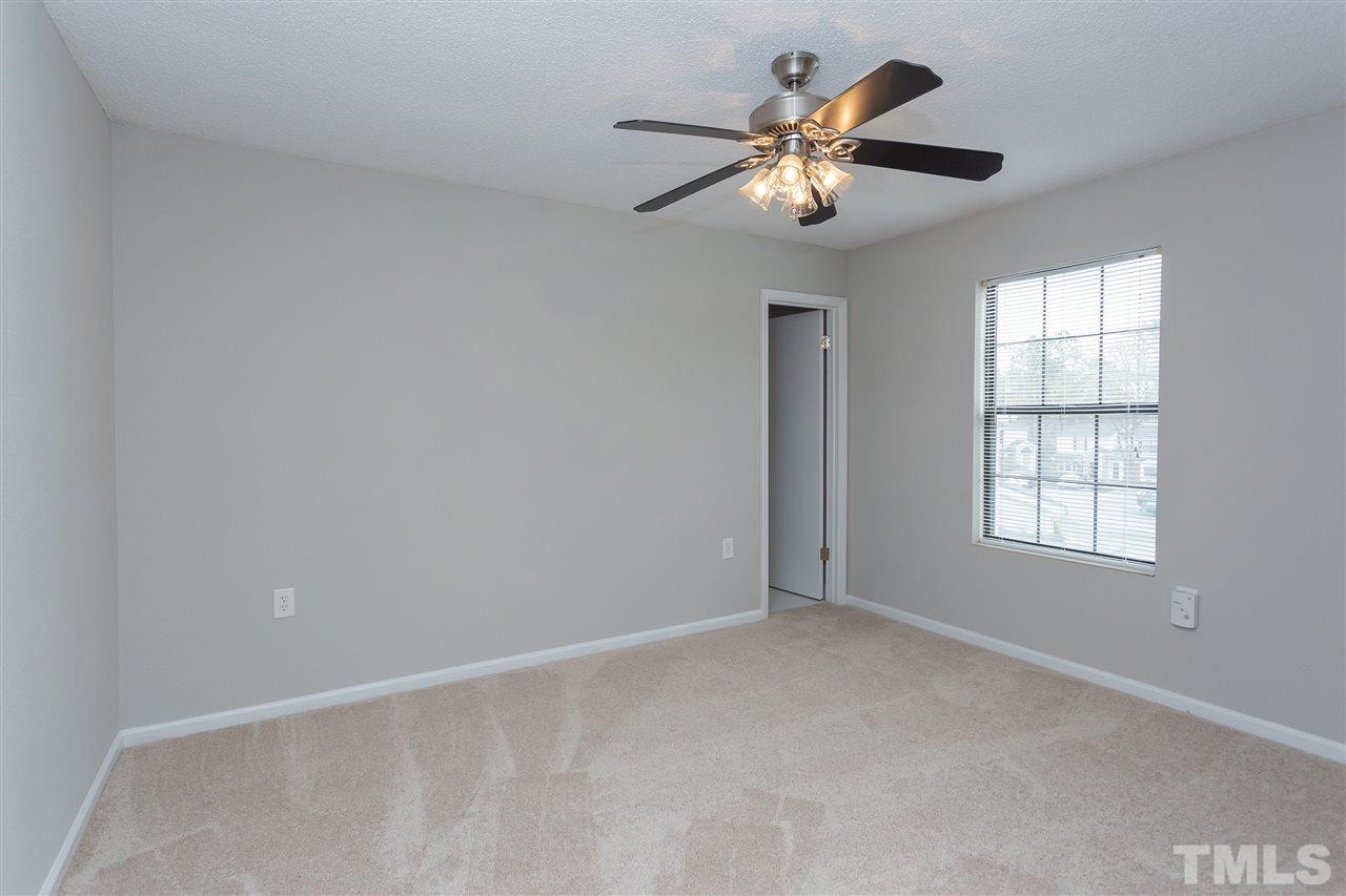 7812 Falcon Rest Circle Raleigh, NC 27615 - Photo 21 of 26 a view of an empty room with a window