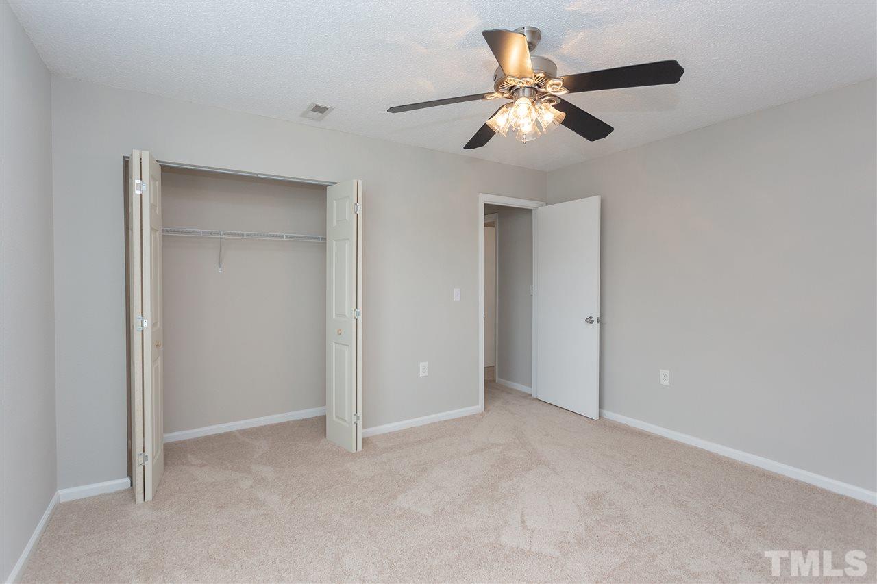7812 Falcon Rest Circle Raleigh, NC 27615 - Photo 22 of 26 a view of an empty room