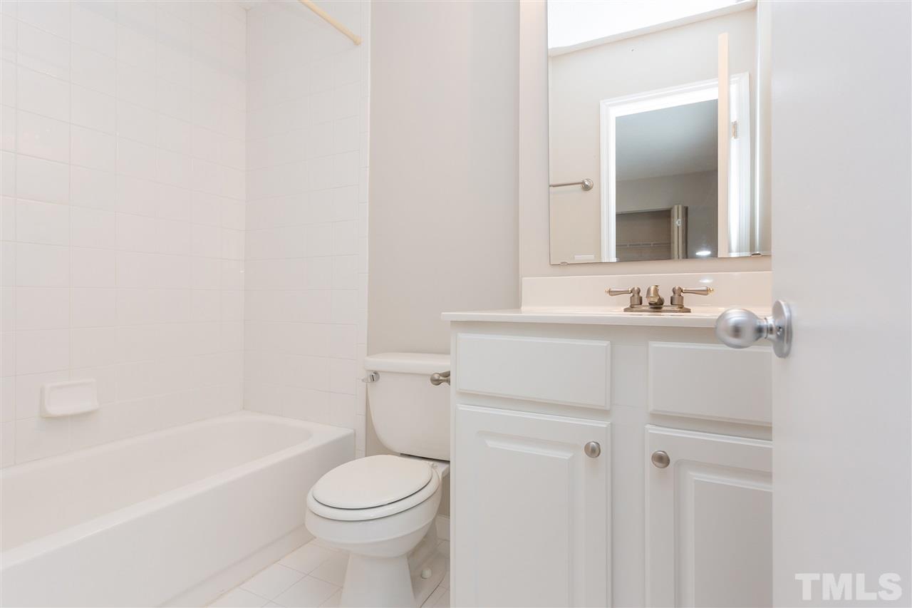 7812 Falcon Rest Circle Raleigh, NC 27615 - Photo 23 of 26 a bathroom with a sink toilet and shower