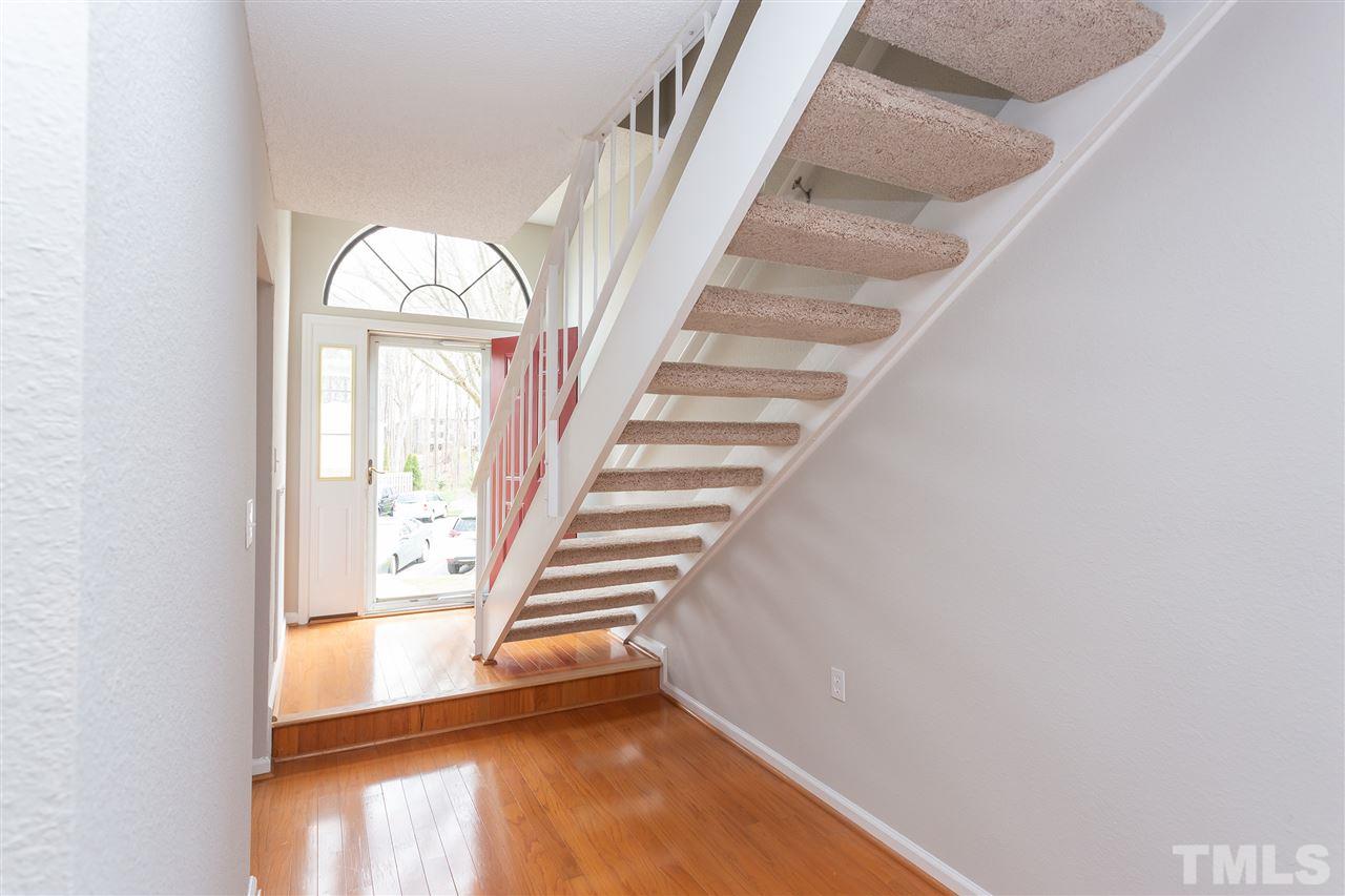7812 Falcon Rest Circle Raleigh, NC 27615 - Photo 5 of 26 a view of entryway and hall with wooden floor