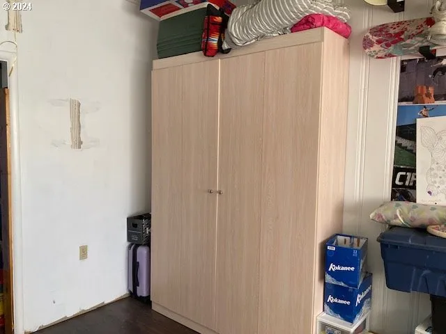 a view of bedroom with a bed and a window