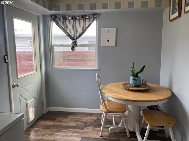 a view of living room with furniture and a window
