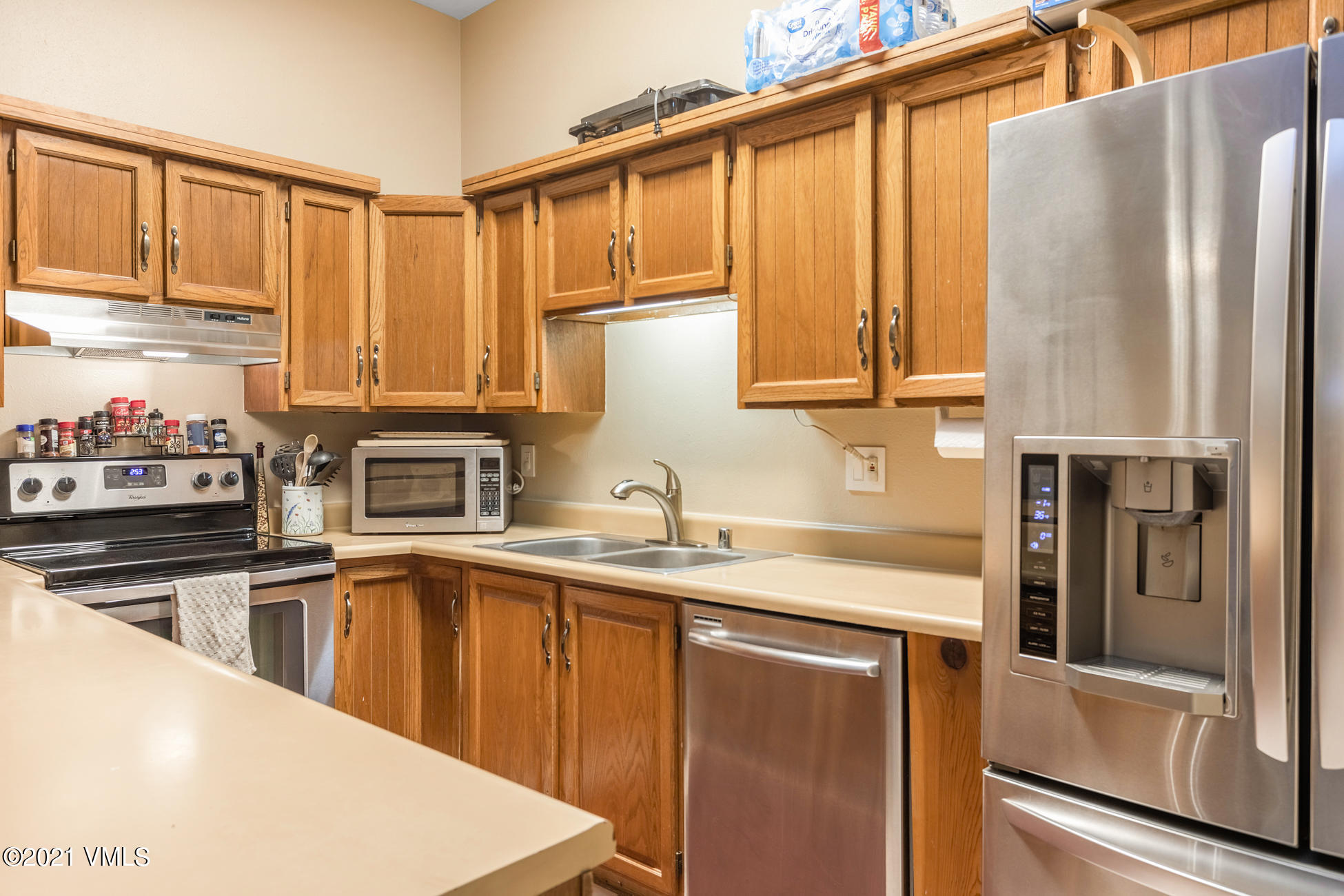280 Gopher Road, Unit 29 Avon, CO 81620 - Photo 1 of 14 a kitchen with stainless steel appliances granite countertop a refrigerator sink and cabinets