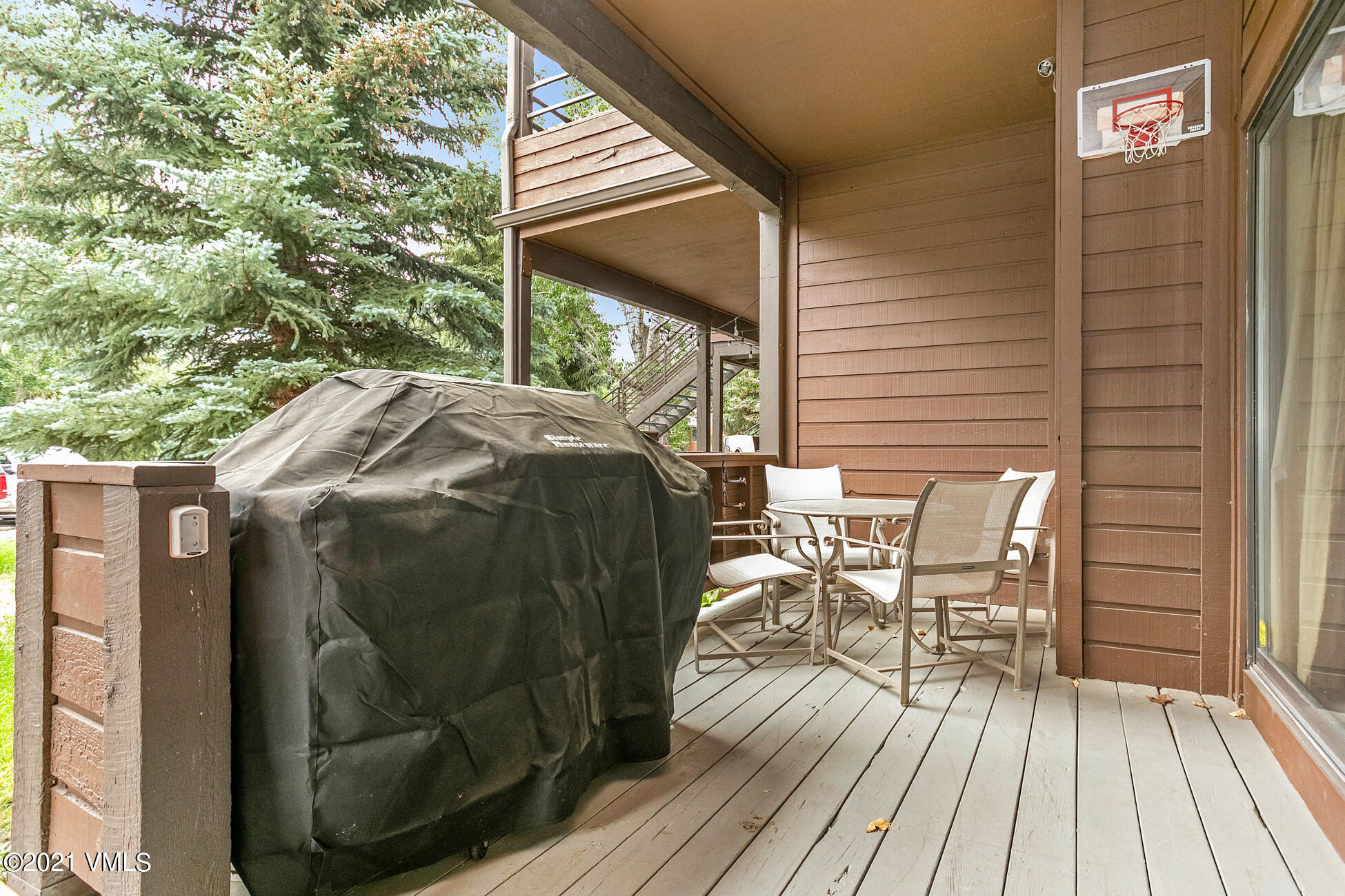 280 Gopher Road, Unit 29 Avon, CO 81620 - Photo 13 of 14 a view of balcony with furniture and wooden floor