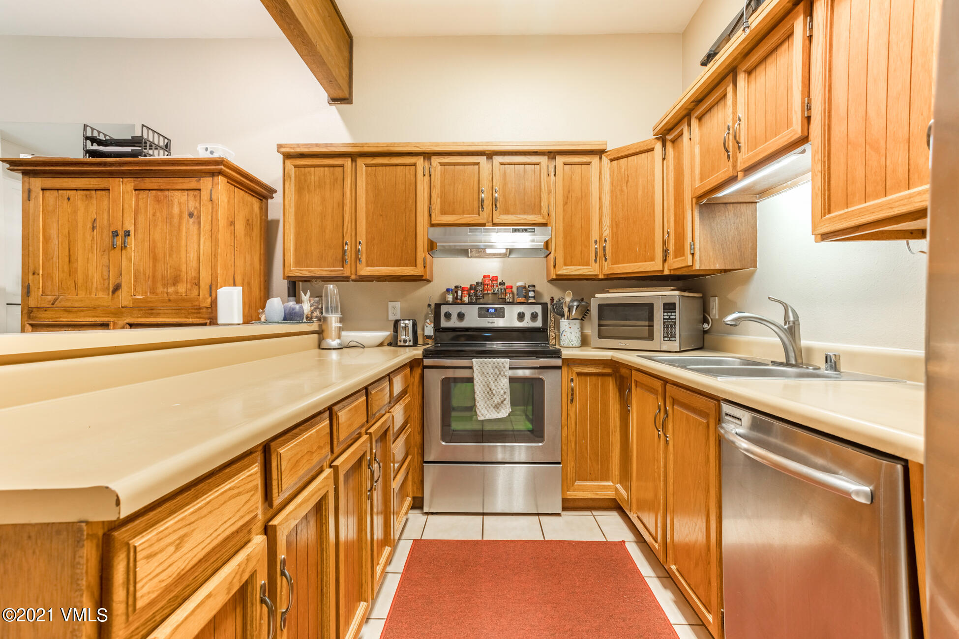 280 Gopher Road, Unit 29 Avon, CO 81620 - Photo 2 of 14 a kitchen with stainless steel appliances granite countertop a stove and a sink
