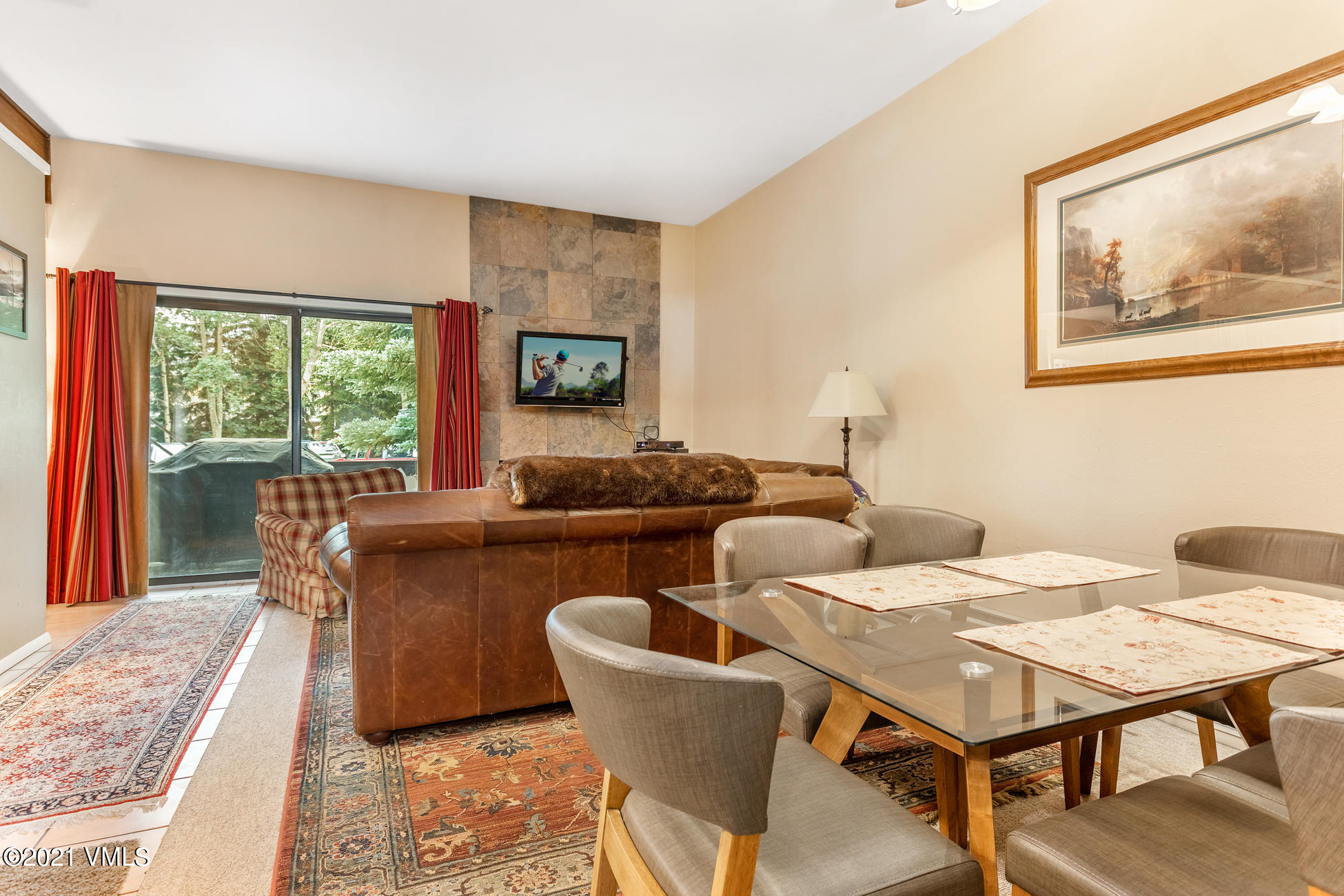 280 Gopher Road, Unit 29 Avon, CO 81620 - Photo 6 of 14 a living room with furniture a large window and dining table