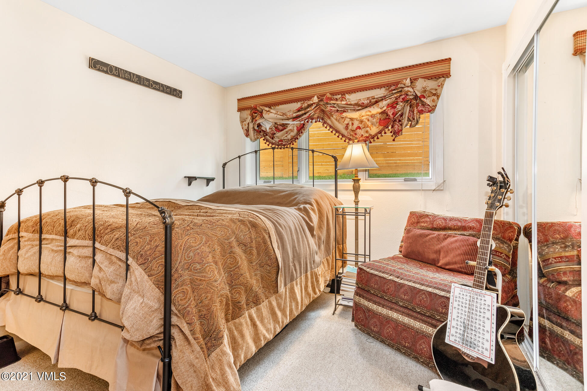 280 Gopher Road, Unit 29 Avon, CO 81620 - Photo 7 of 14 a bedroom with a bed and wooden floor