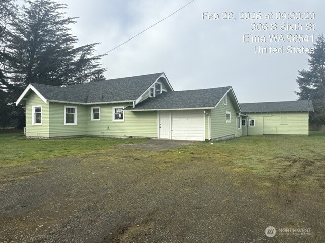 306 South 6th Street Satsop, WA 98541 - Photo 2 of 13 a front view of a house with a garden