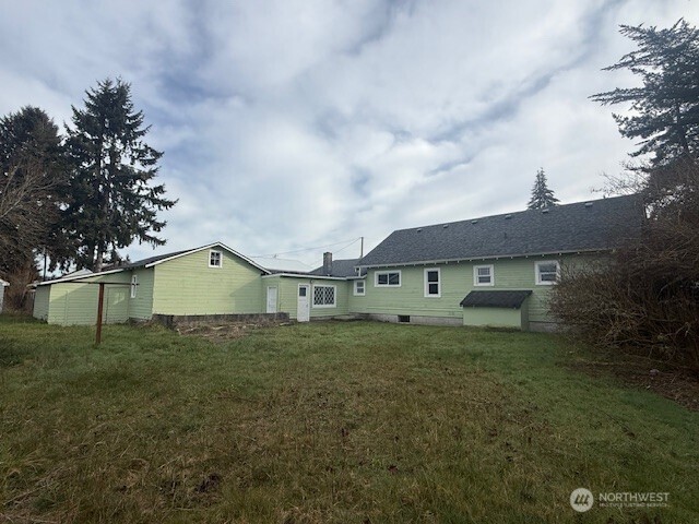 306 South 6th Street Satsop, WA 98541 - Photo 5 of 13 a front view of a house with a yard