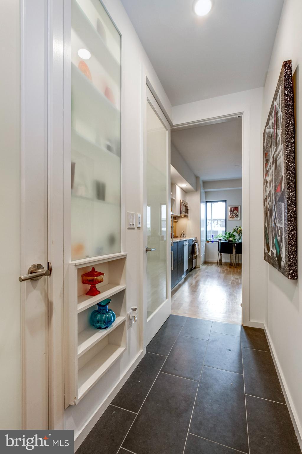 1942 North Front Street, Unit 206 Philadelphia, PA 19122 - Photo 7 of 14 a view of a hallway with dining area
