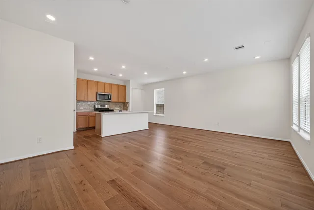 a view of kitchen with wooden floor