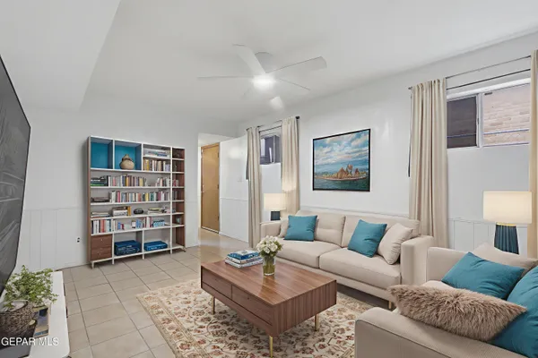 a living room with furniture and walk in closet