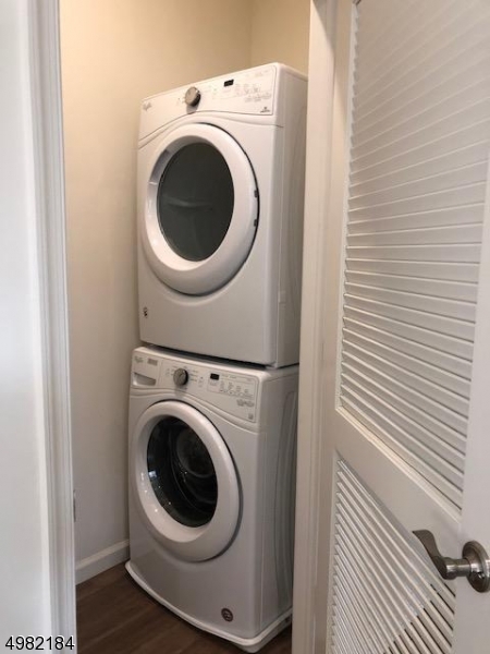 60 Passaic Avenue, Unit 22 Fairfield, NJ 07004 - Photo 7 of 13 a utility room with dryer and washer