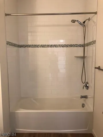 a bathroom with a shower and a shower