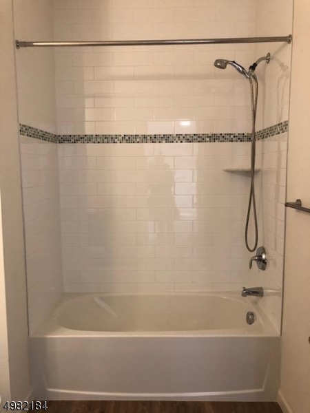 60 Passaic Avenue, Unit 22 Fairfield, NJ 07004 - Photo 8 of 13 a bathroom with a shower and a shower