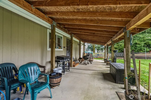 a view of swimming pool with outdoor seating