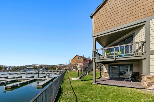 a view of a house with a deck and a garden