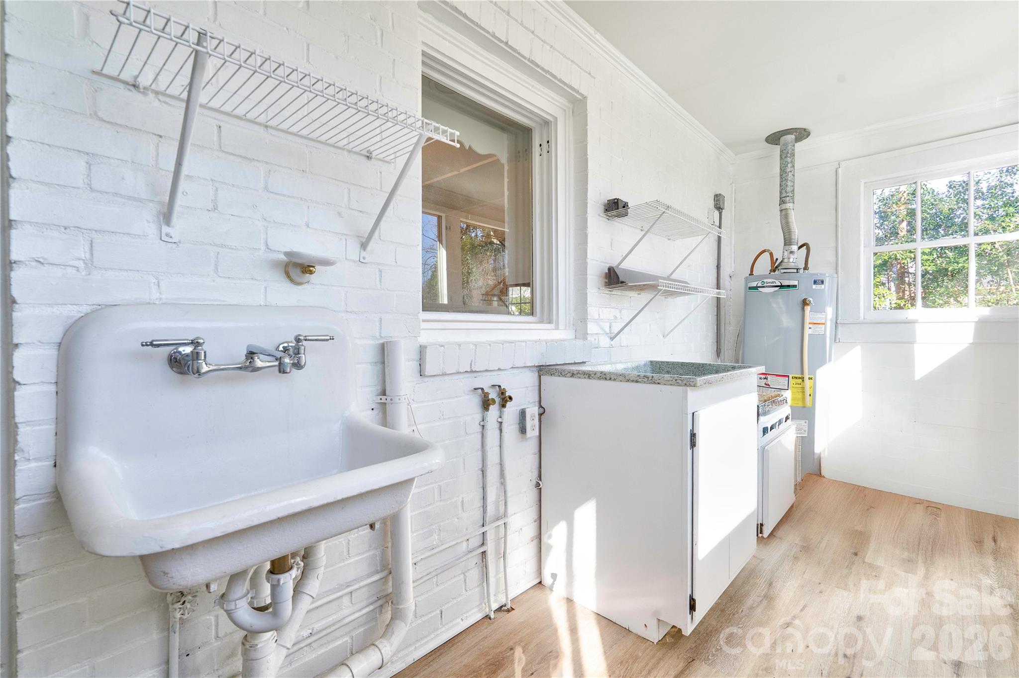 171 Center Street Spindale, NC 28160 - Photo 34 of 34 a bathroom with a sink a mirror and a window