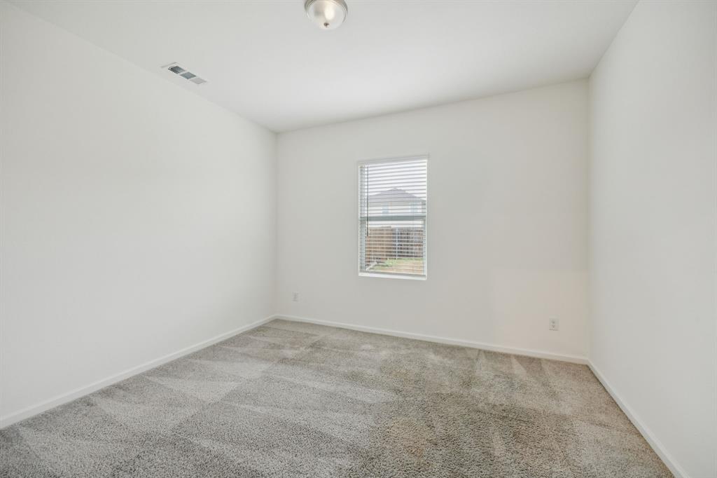 1902 Marquette Road Princeton, TX 75407 - Photo 14 of 30 an empty room with a window