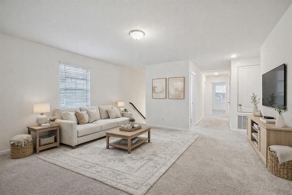 1902 Marquette Road Princeton, TX 75407 - Photo 15 of 30 a living room with furniture and a flat screen tv