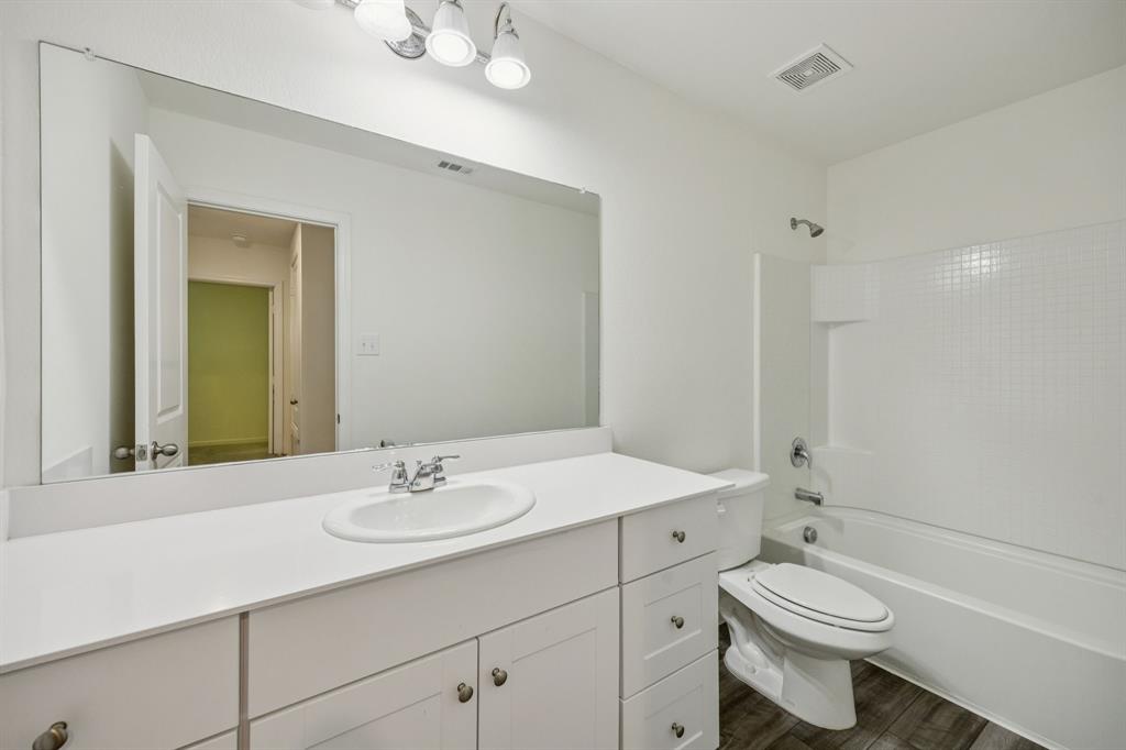 1902 Marquette Road Princeton, TX 75407 - Photo 17 of 30 a bathroom with a sink a toilet and shower