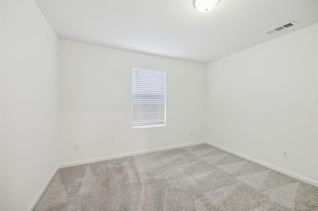 1902 Marquette Road Princeton, TX 75407 - Photo 18 of 30 an empty room with a window