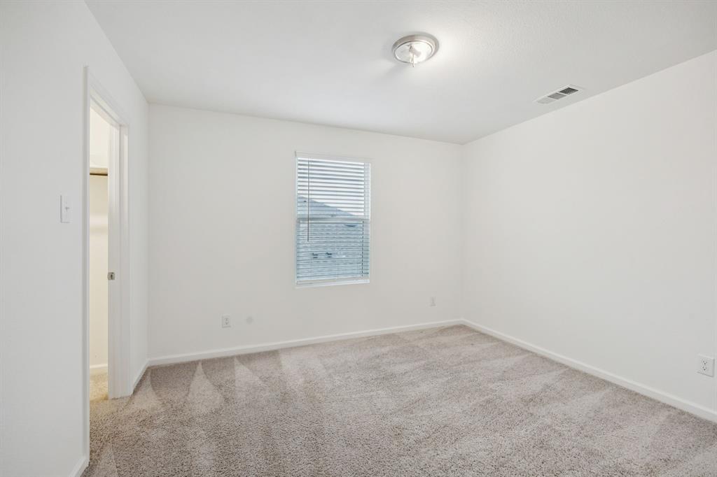 1902 Marquette Road Princeton, TX 75407 - Photo 21 of 30 an empty room with a window