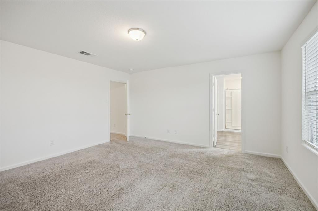 1902 Marquette Road Princeton, TX 75407 - Photo 24 of 30 an empty room with windows