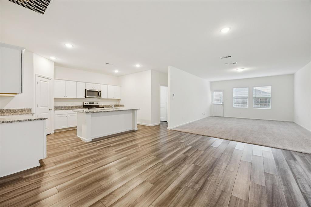 1902 Marquette Road Princeton, TX 75407 - Photo 4 of 30 a view of kitchen with wooden floor and electronic appliances
