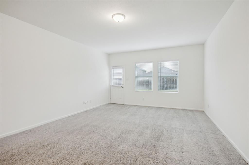 1902 Marquette Road Princeton, TX 75407 - Photo 9 of 30 an empty room with windows
