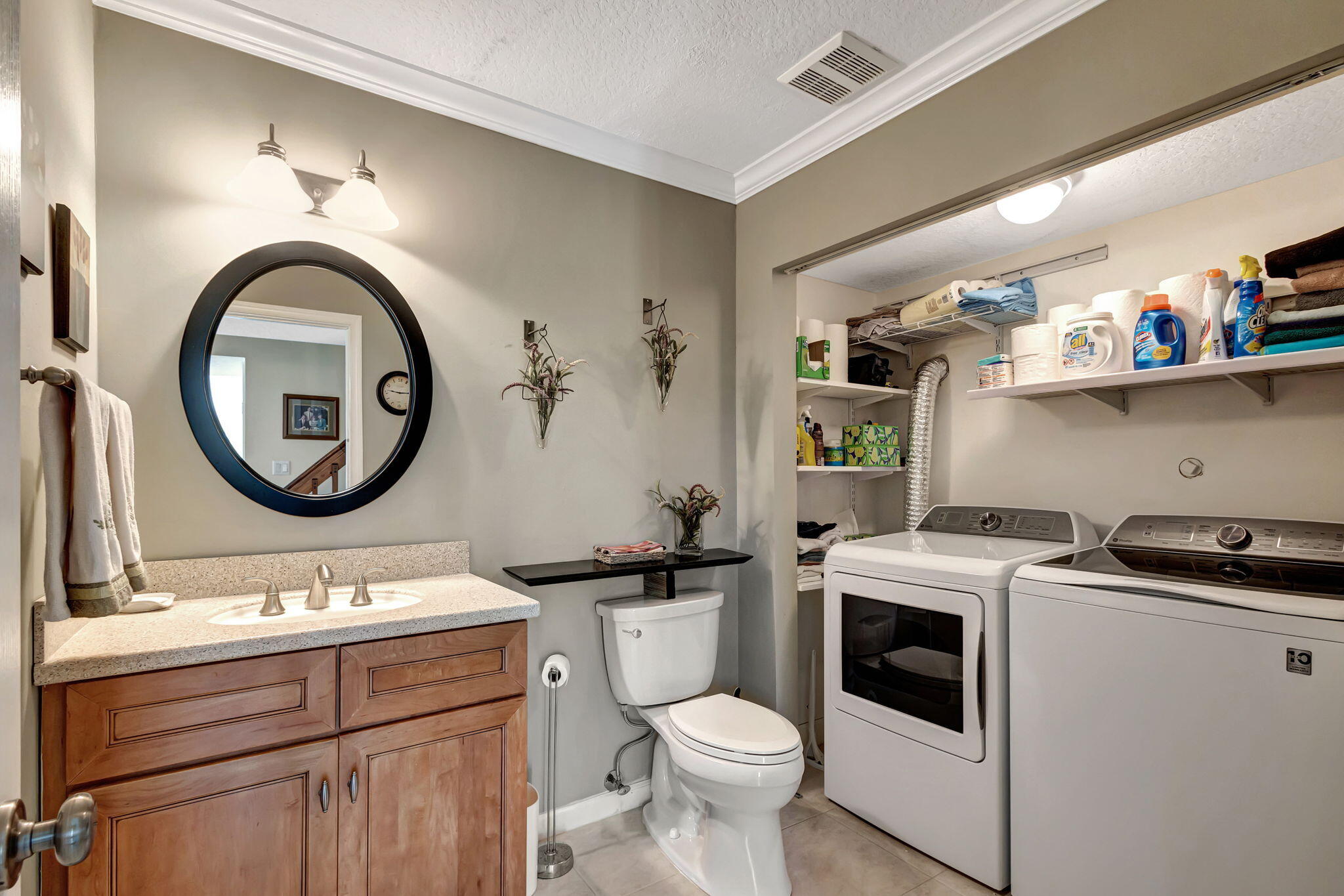 1420 Ocean Way, Unit 23B Jupiter, FL 33477 - Photo 11 of 29 a bathroom with a toilet a sink and a mirror