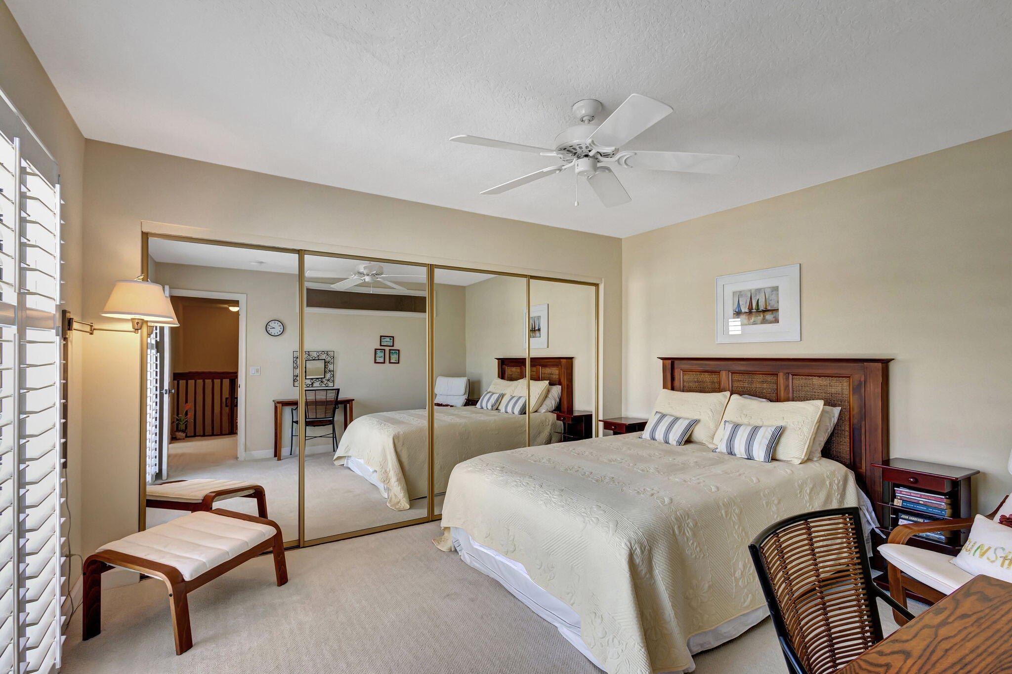 1420 Ocean Way, Unit 23B Jupiter, FL 33477 - Photo 18 of 29 a bedroom with furniture and a chandelier