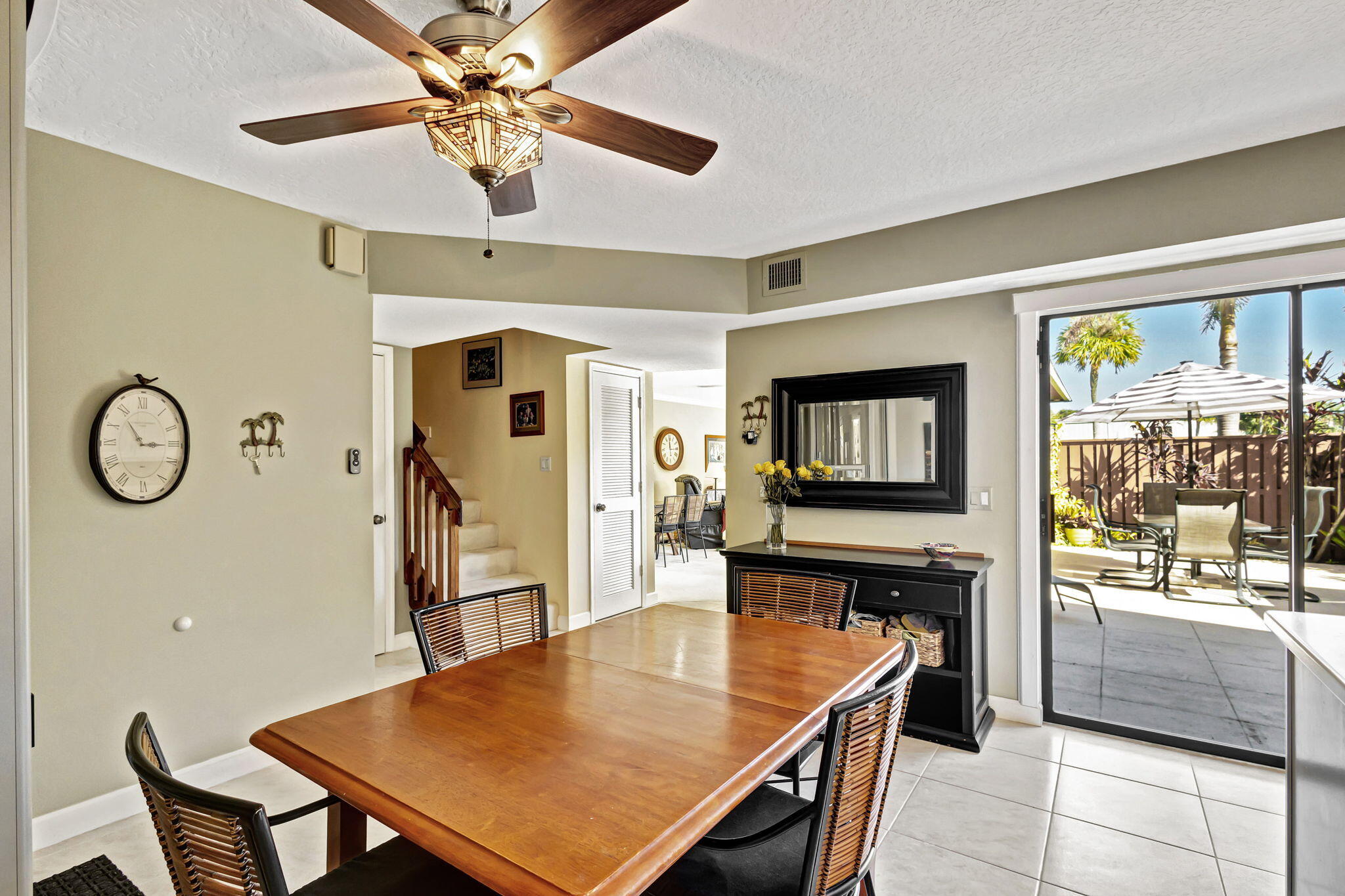1420 Ocean Way, Unit 23B Jupiter, FL 33477 - Photo 9 of 29 a living room with furniture a flat screen tv and a table