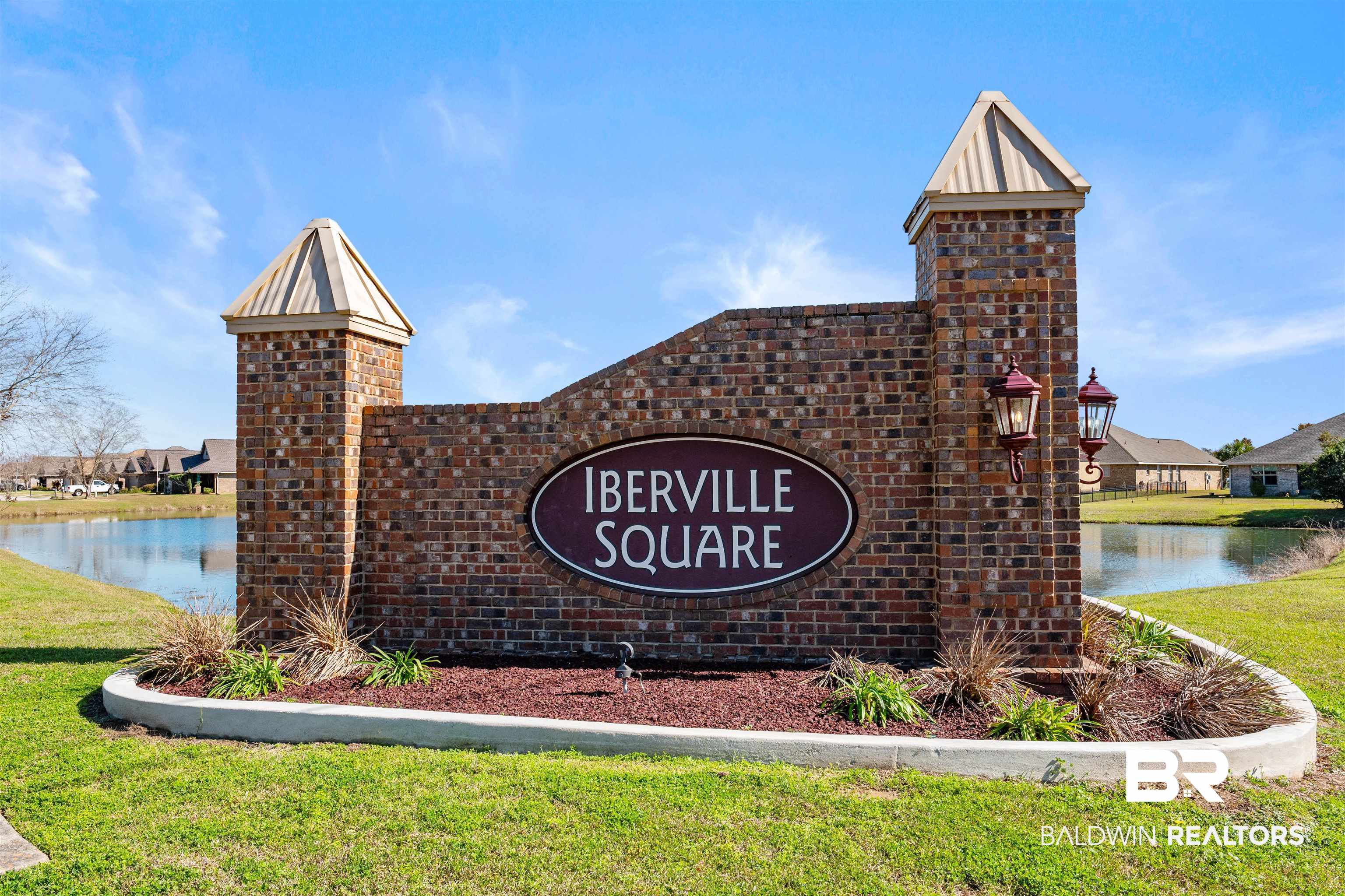 1850 Arcadia Drive Foley, AL 36535 - Photo 41 of 44 Community / neighborhood sign with a lawn and a water view