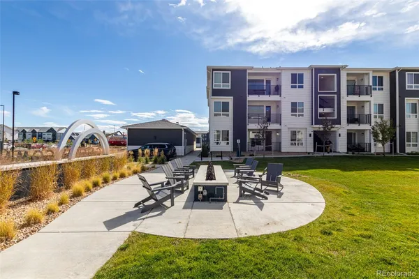 a swimming pool with outdoor seating yard and barbeque oven