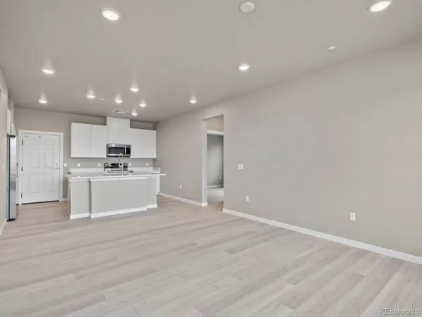 a view of kitchen with wooden floor