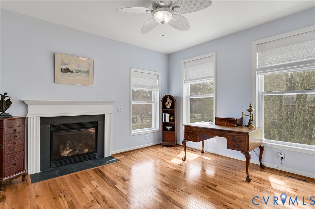 1667 Locust Grove Road Topping, VA 23169 - Photo 7 of 45 Home office with light wood-type flooring, a firep