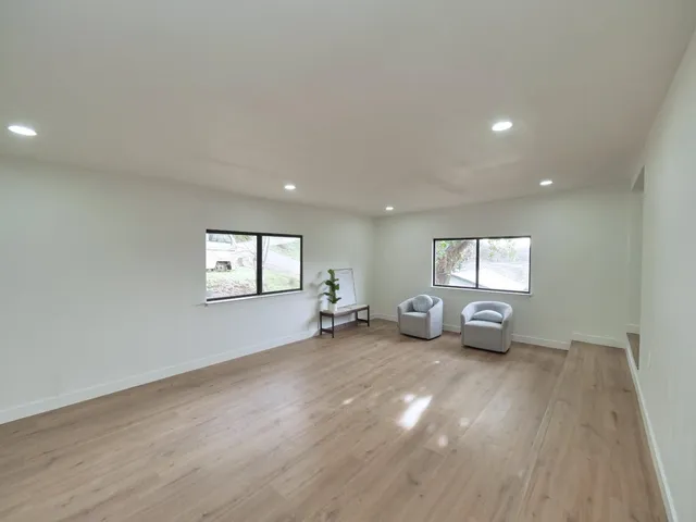 a view of livingroom and hardwood floor