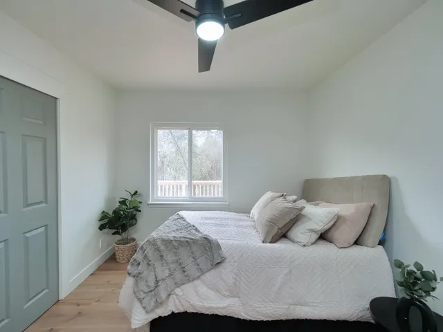 a bathroom with a double vanity sink a mirror and a bathtub