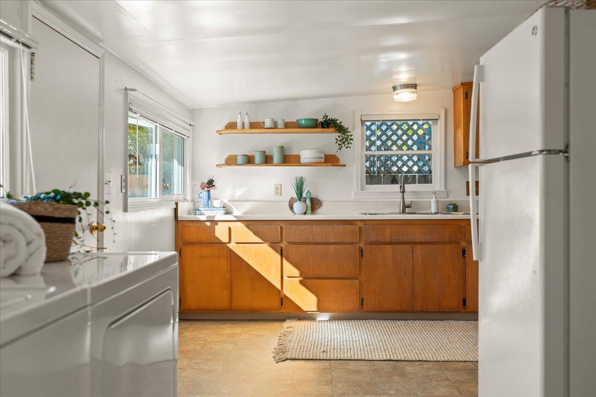 207 2nd Avenue Santa Cruz, CA 95062 - Photo 16 of 38 a living room with stainless steel appliances kitchen island granite countertop furniture and a large window